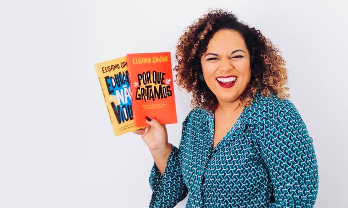 Foto de Elisama com seus livros. Estou lendo o outro já! - Isaac Martins / divulgação